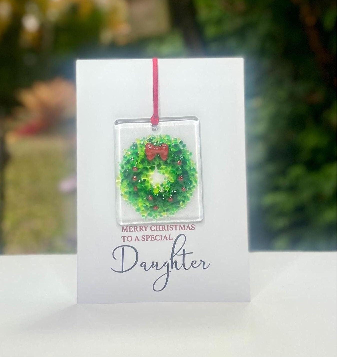 Merry Christmas Daughter card with detachable handmade glass holly wreath decoration